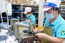 Factories labor to ensure workers return after Tet