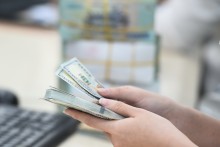 Dollar inches up against dong